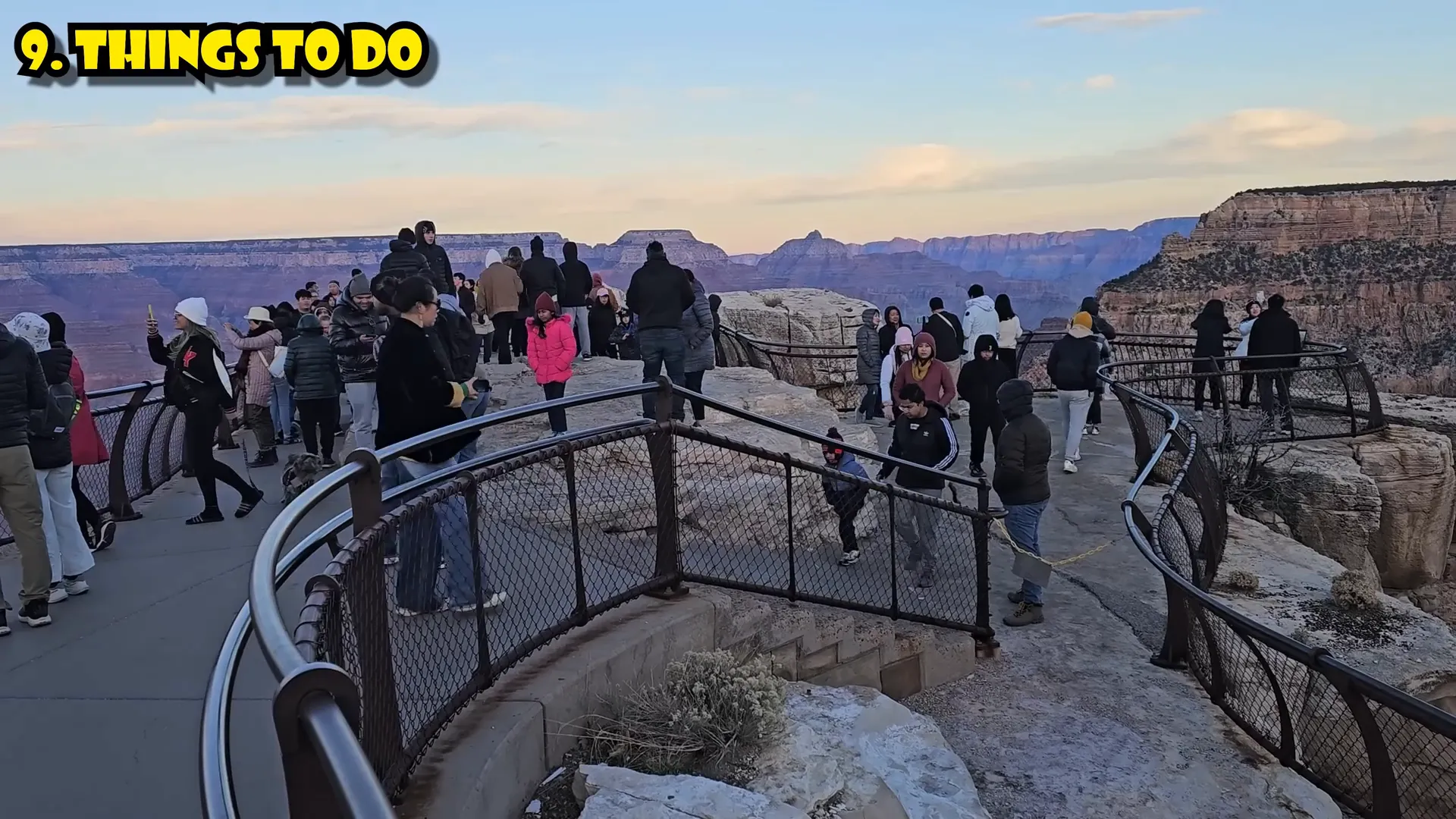 Sunrise at Mather Point with visitors admiring the Grand Canyon