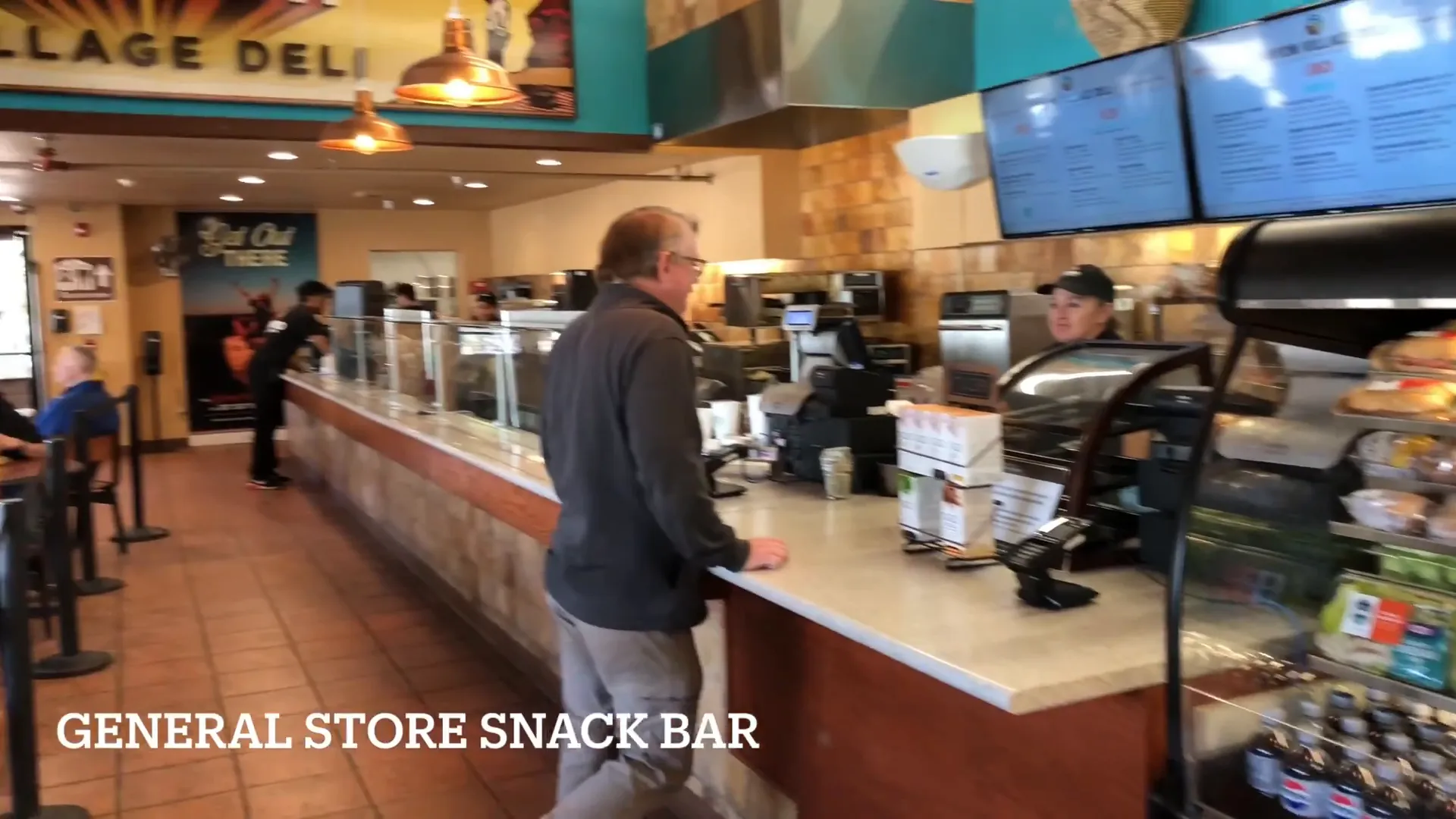 Snack bar in front of General Store with pizza options