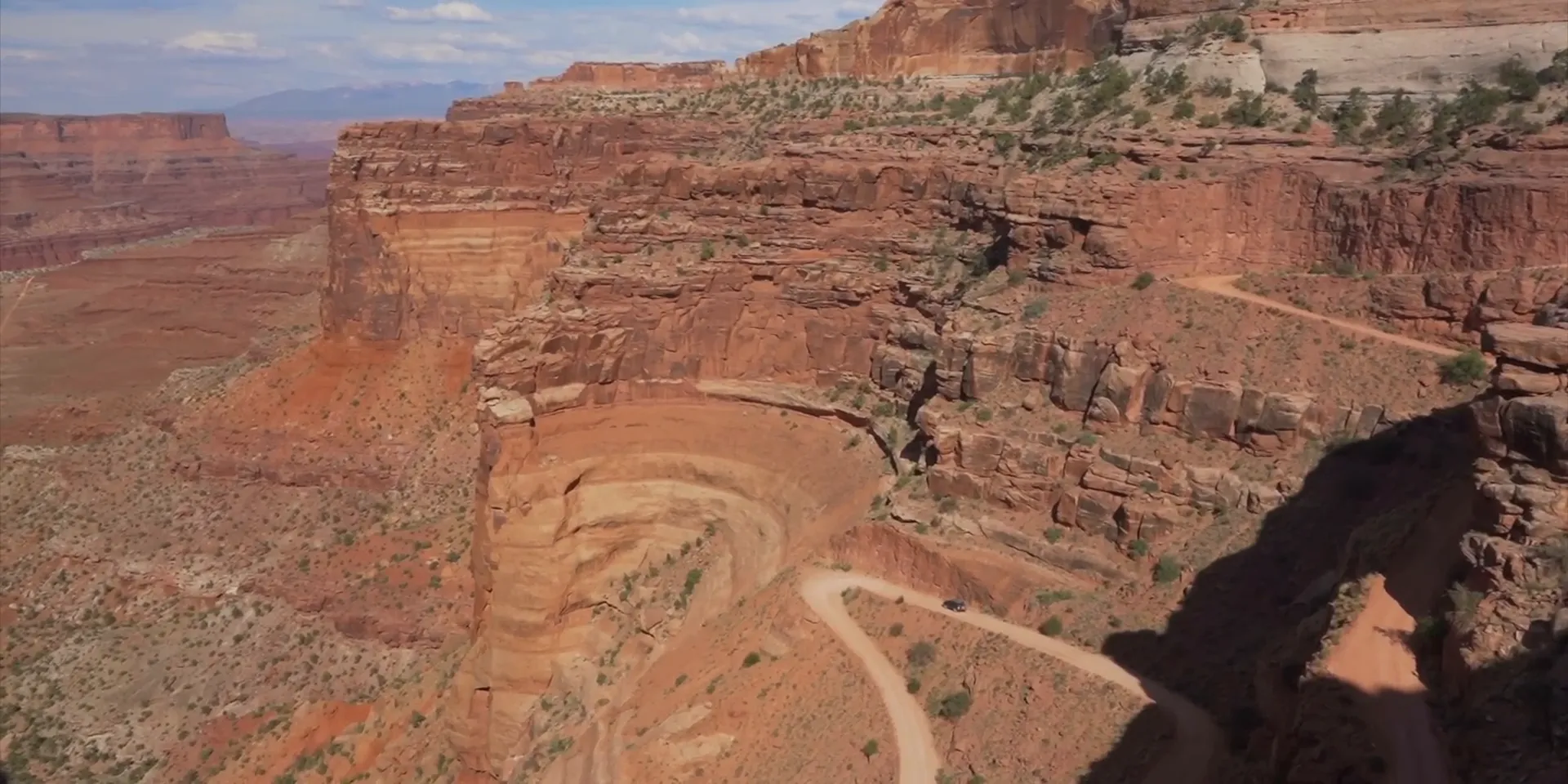 Schaeffer Trail switchbacks with red cliffs and steep drop-offs, scenic overlook reminiscent of a movie-set