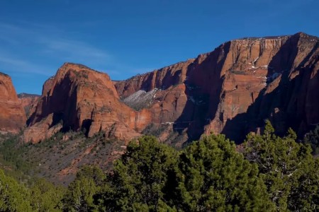 Red rock mountains with pine-covered valley near St. George, Utah