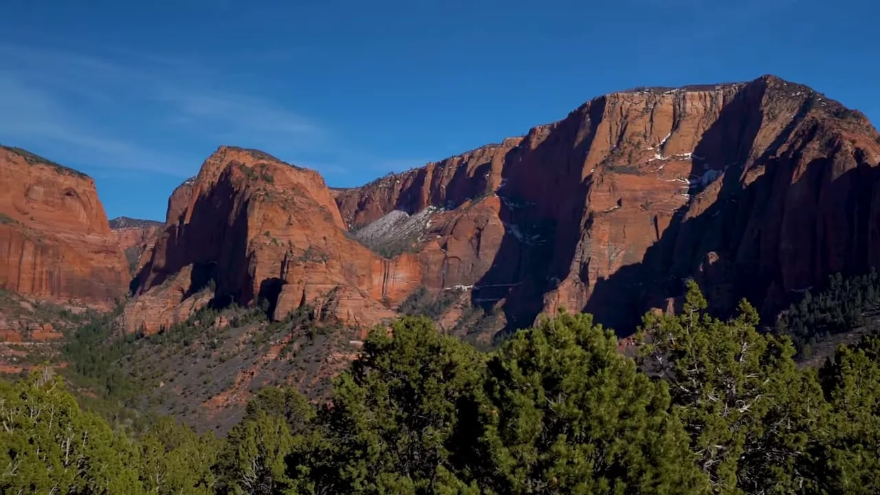 Red rock mountains with pine-covered valley near St. George, Utah